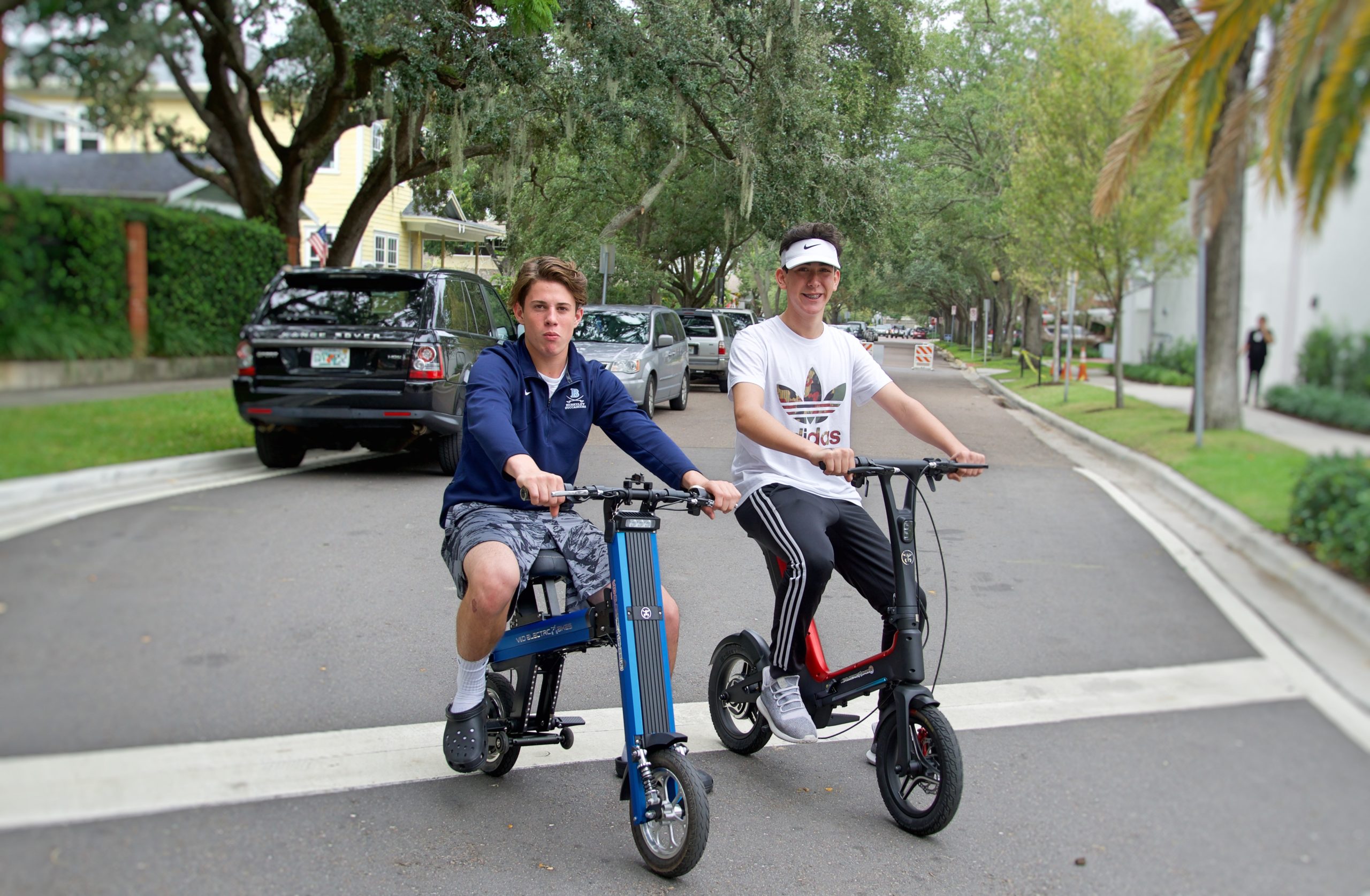 two boys on electric bikes